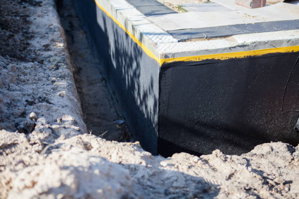 Professional Waterproofing technician working in Huntersville, NC